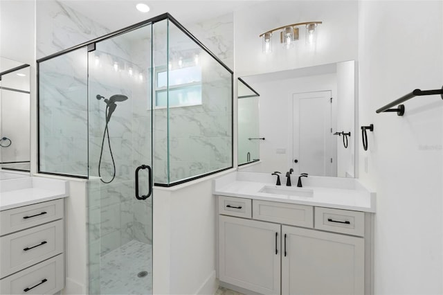 bathroom with vanity and an enclosed shower