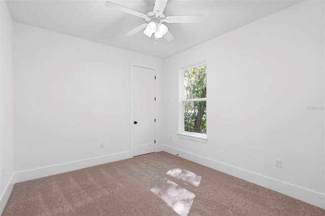 4190 Rossmore Dr, Orlando, FL 32810 - carpeted empty room featuring baseboards and a ceiling fan