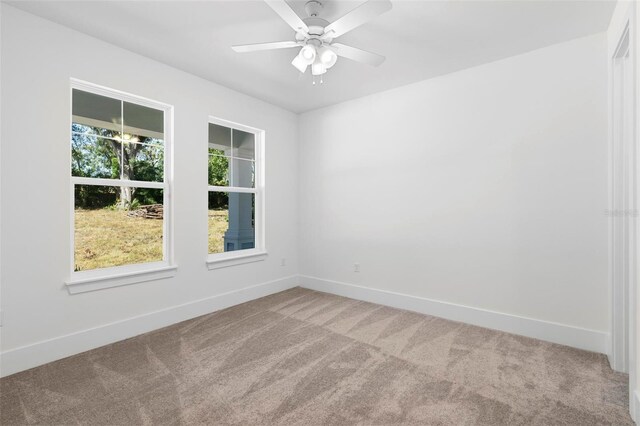 4190 Rossmore Dr, Orlando, FL 32810 - empty room with carpet, baseboards, and ceiling fan