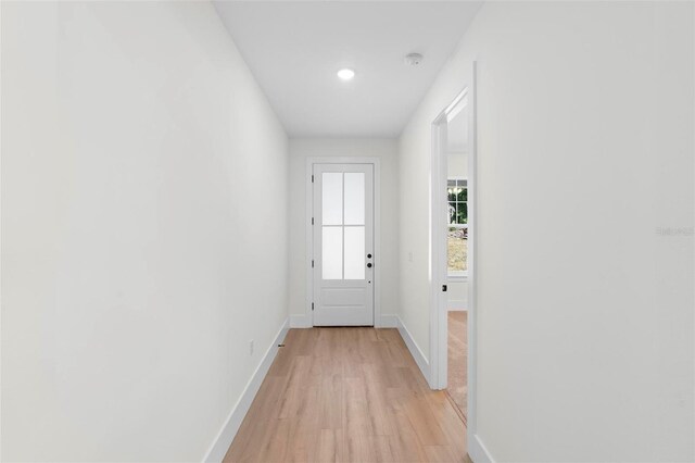 4190 Rossmore Dr, Orlando, FL 32810 - doorway to outside with light wood-style floors, baseboards, and recessed lighting