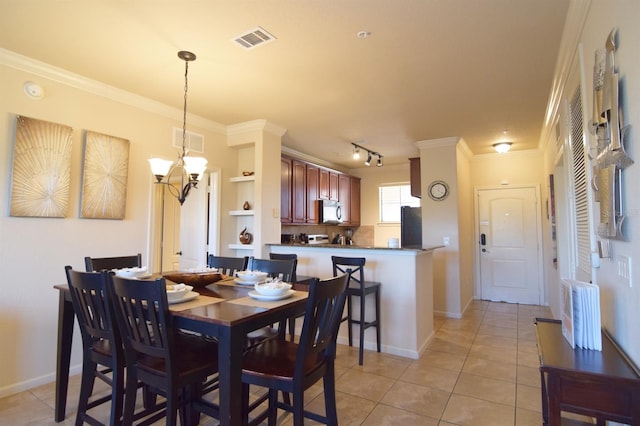 tiled dining space with ornamental molding