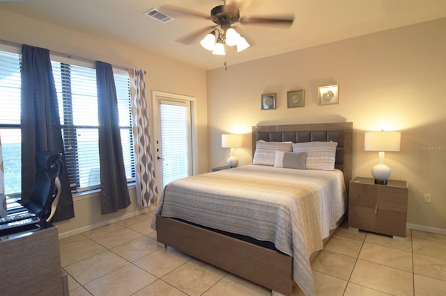 bedroom with light tile patterned flooring and ceiling fan