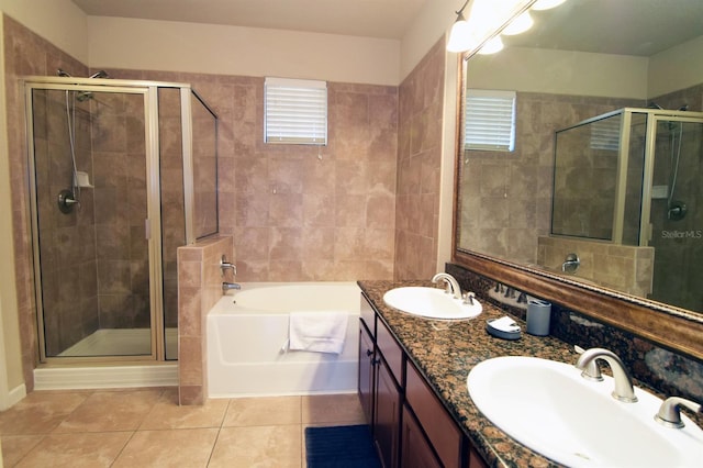 bathroom with vanity, separate shower and tub, a wealth of natural light, and tile patterned flooring