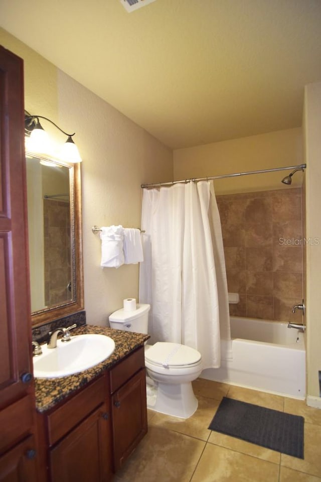 full bathroom featuring vanity, shower / tub combo, toilet, and tile patterned flooring