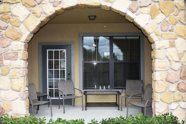 doorway to property featuring a patio area