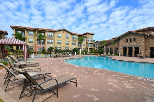 view of swimming pool featuring a gazebo and a patio area