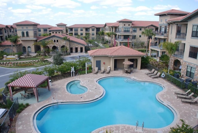 view of swimming pool featuring a gazebo and a patio area