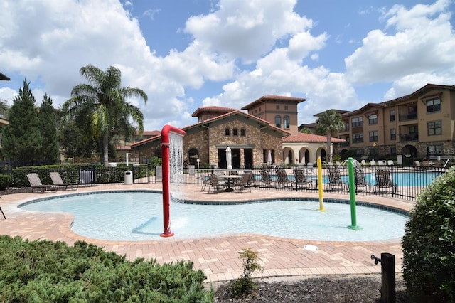 view of swimming pool featuring a patio area and pool water feature