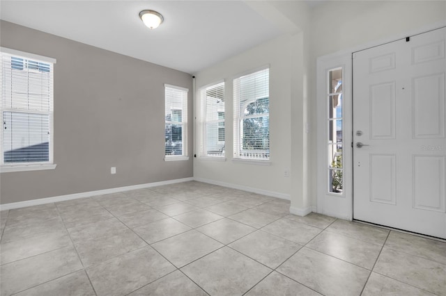 entrance foyer with light tile patterned flooring