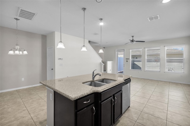 kitchen with sink, stainless steel dishwasher, pendant lighting, a center island with sink, and ceiling fan with notable chandelier