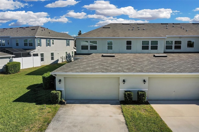 exterior space featuring a garage and a front lawn