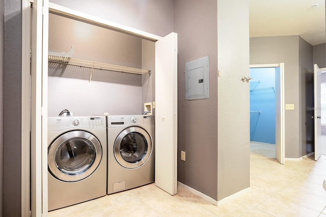 washroom featuring electric panel and washing machine and dryer