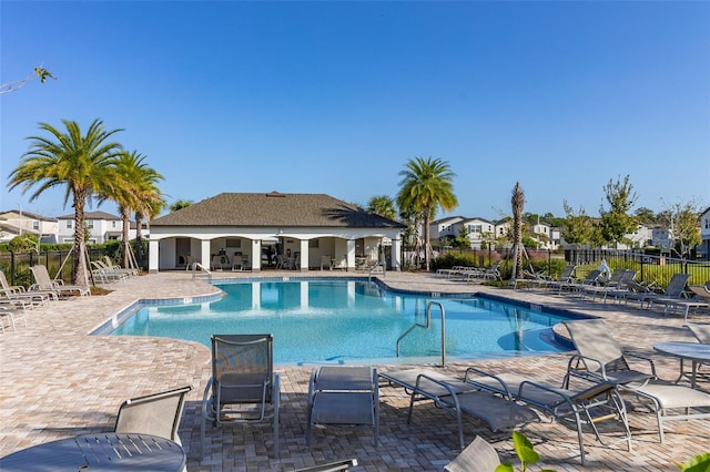 view of swimming pool featuring a patio area