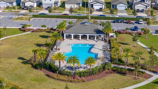 view of pool with a yard and a patio area