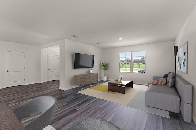 living room with dark hardwood / wood-style flooring