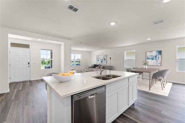 kitchen featuring sink, white cabinetry, dark wood-type flooring, stainless steel dishwasher, and a kitchen island with sink