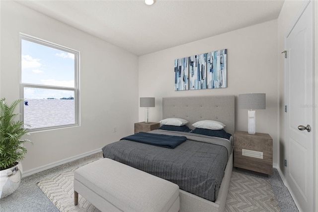 bedroom featuring light colored carpet