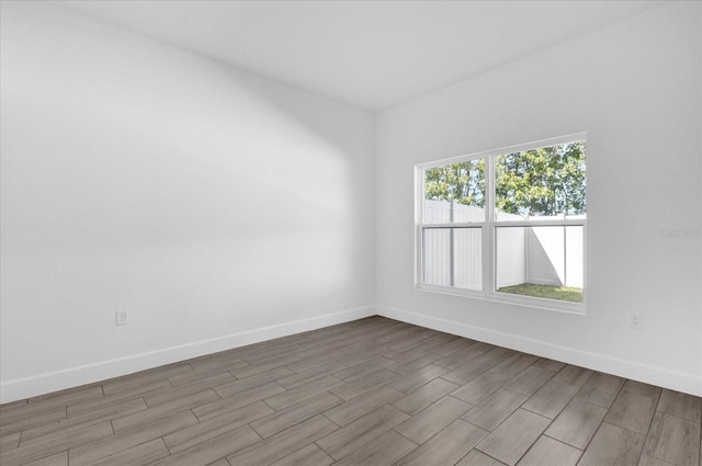 unfurnished room with light wood-type flooring