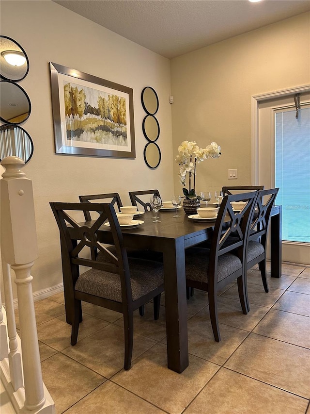 dining area with tile patterned flooring