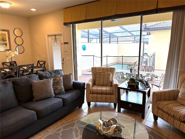 9033 Rhodes St, Kissimmee, FL 34747 - tiled living area with a sunroom and recessed lighting