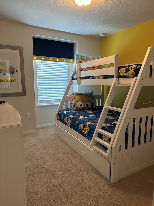 9033 Rhodes St, Kissimmee, FL 34747 - bedroom with carpet floors and a textured ceiling