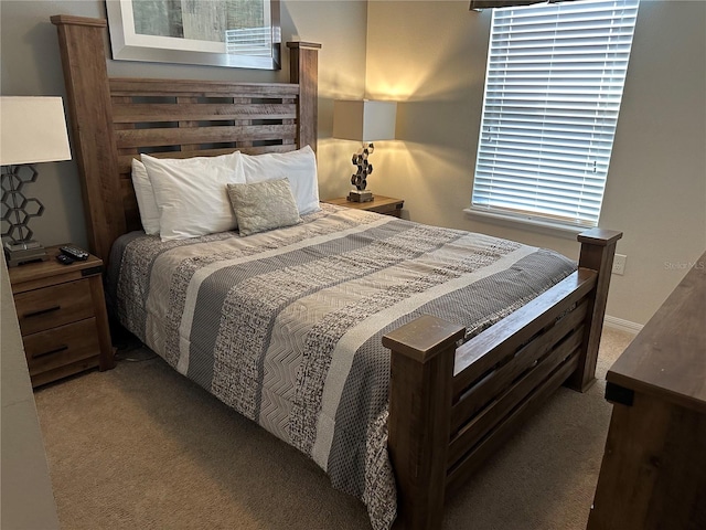 carpeted bedroom with multiple windows