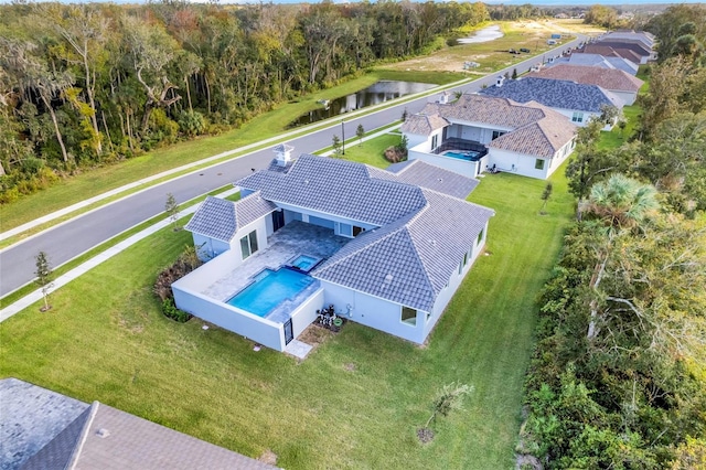 birds eye view of property featuring a water view