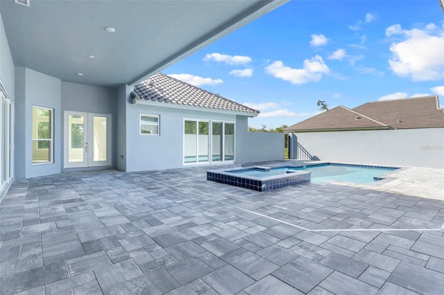 view of swimming pool with an in ground hot tub and a patio area