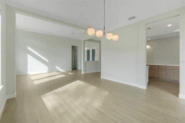 spare room with light wood-type flooring