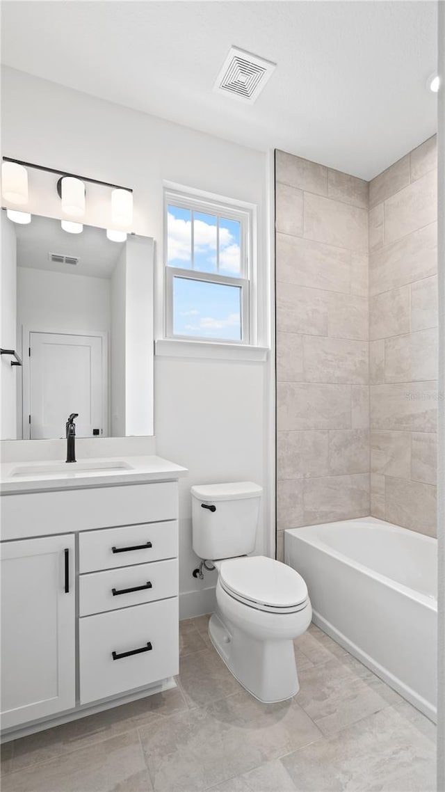 full bathroom featuring toilet, shower / tub combination, vanity, and visible vents