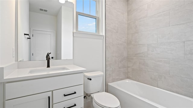 bathroom featuring visible vents, vanity, and toilet