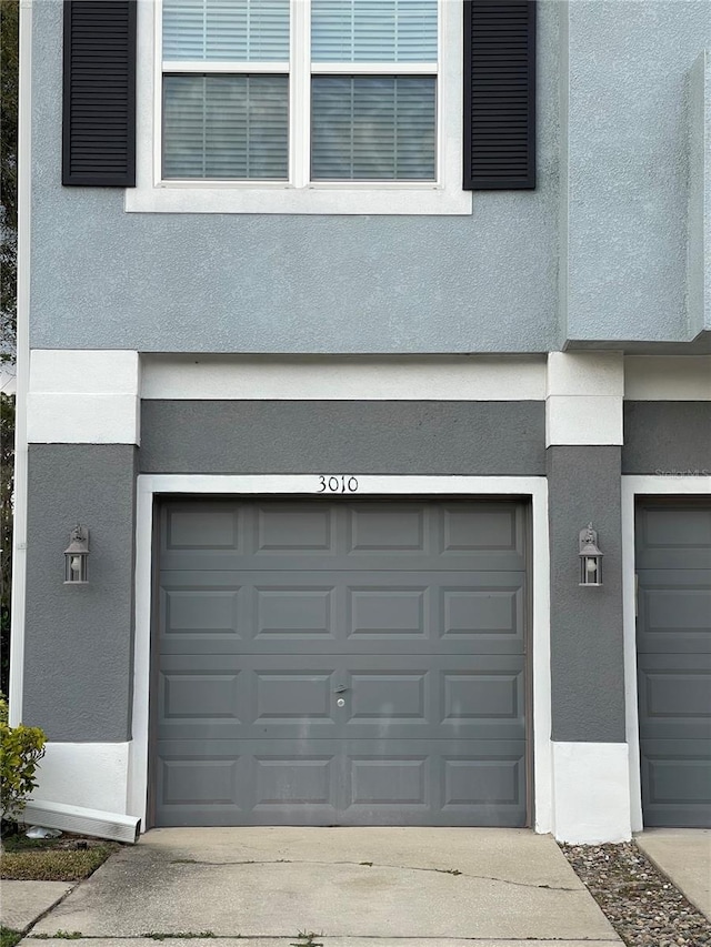 garage with concrete driveway