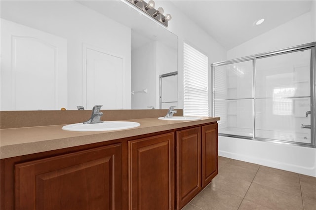 full bath with enclosed tub / shower combo, tile patterned flooring, a sink, and lofted ceiling