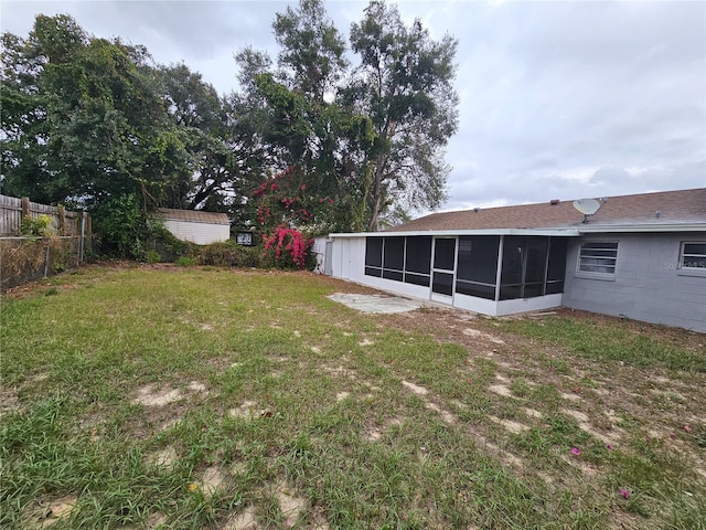 view of yard with a sunroom