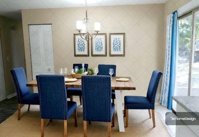 dining space featuring hardwood / wood-style flooring, tile walls, and a chandelier