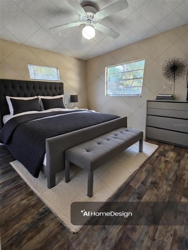 bedroom with hardwood / wood-style flooring and ceiling fan