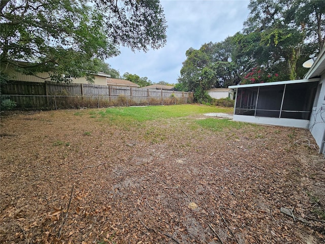 view of yard with a sunroom