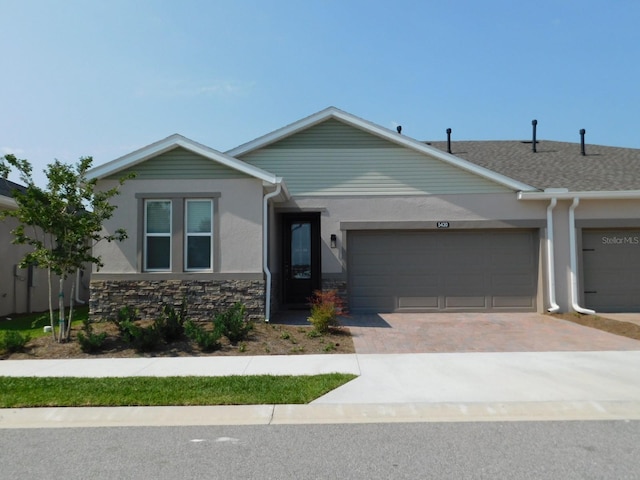 ranch-style house featuring a garage