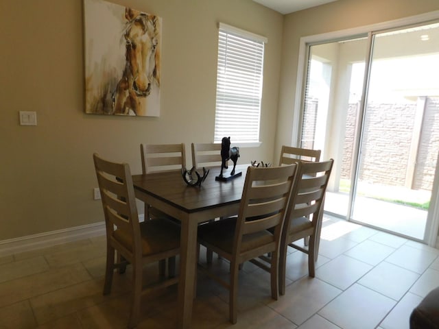 dining room with light tile patterned flooring