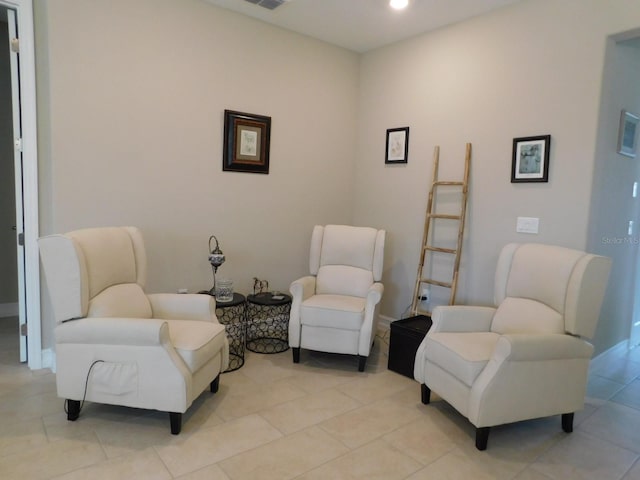 sitting room with light tile patterned floors