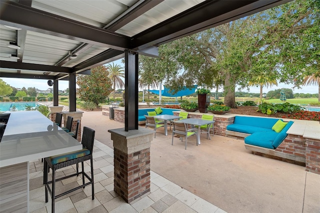 view of patio featuring a pool