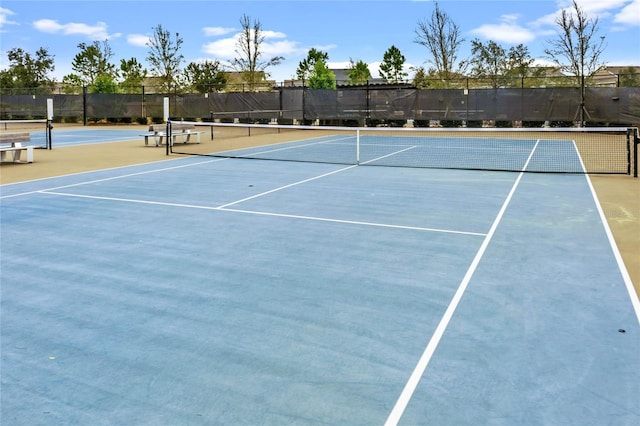 view of sport court with basketball hoop