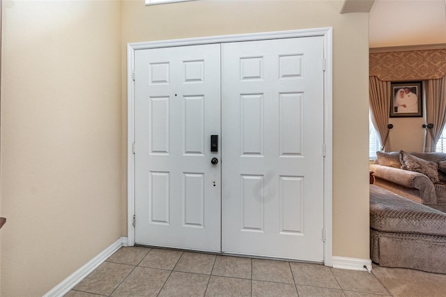 foyer featuring light tile patterned floors