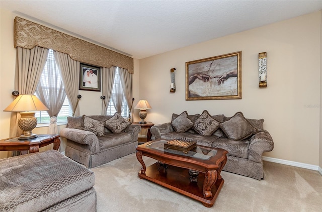 living room featuring carpet floors and a textured ceiling