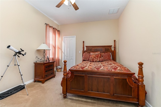 bedroom featuring light carpet, a closet, and ceiling fan