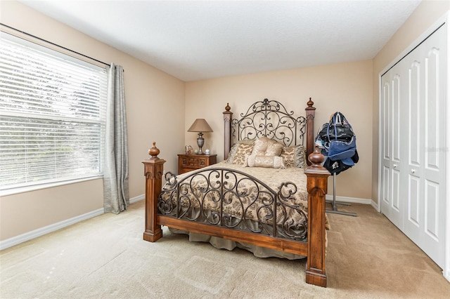 carpeted bedroom with a closet