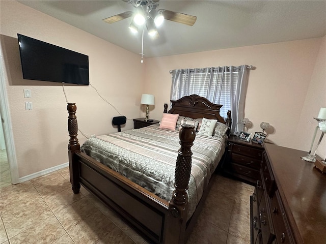 bedroom with light tile patterned floors and ceiling fan