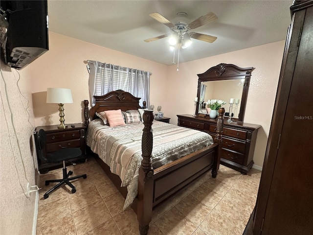 tiled bedroom featuring ceiling fan