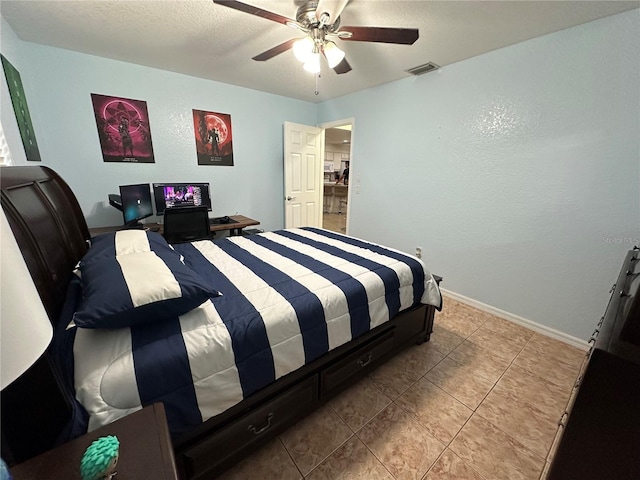 tiled bedroom with ceiling fan