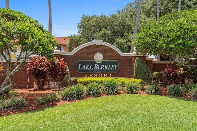 community / neighborhood sign with a lawn